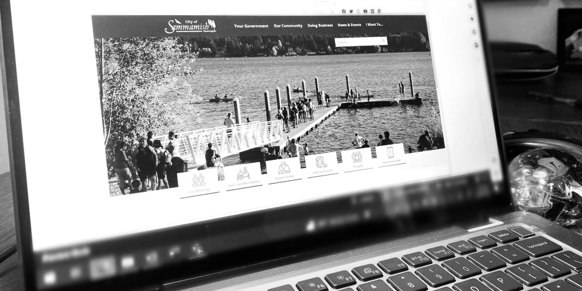 Artistic black and white photo of new website on widescreen laptop